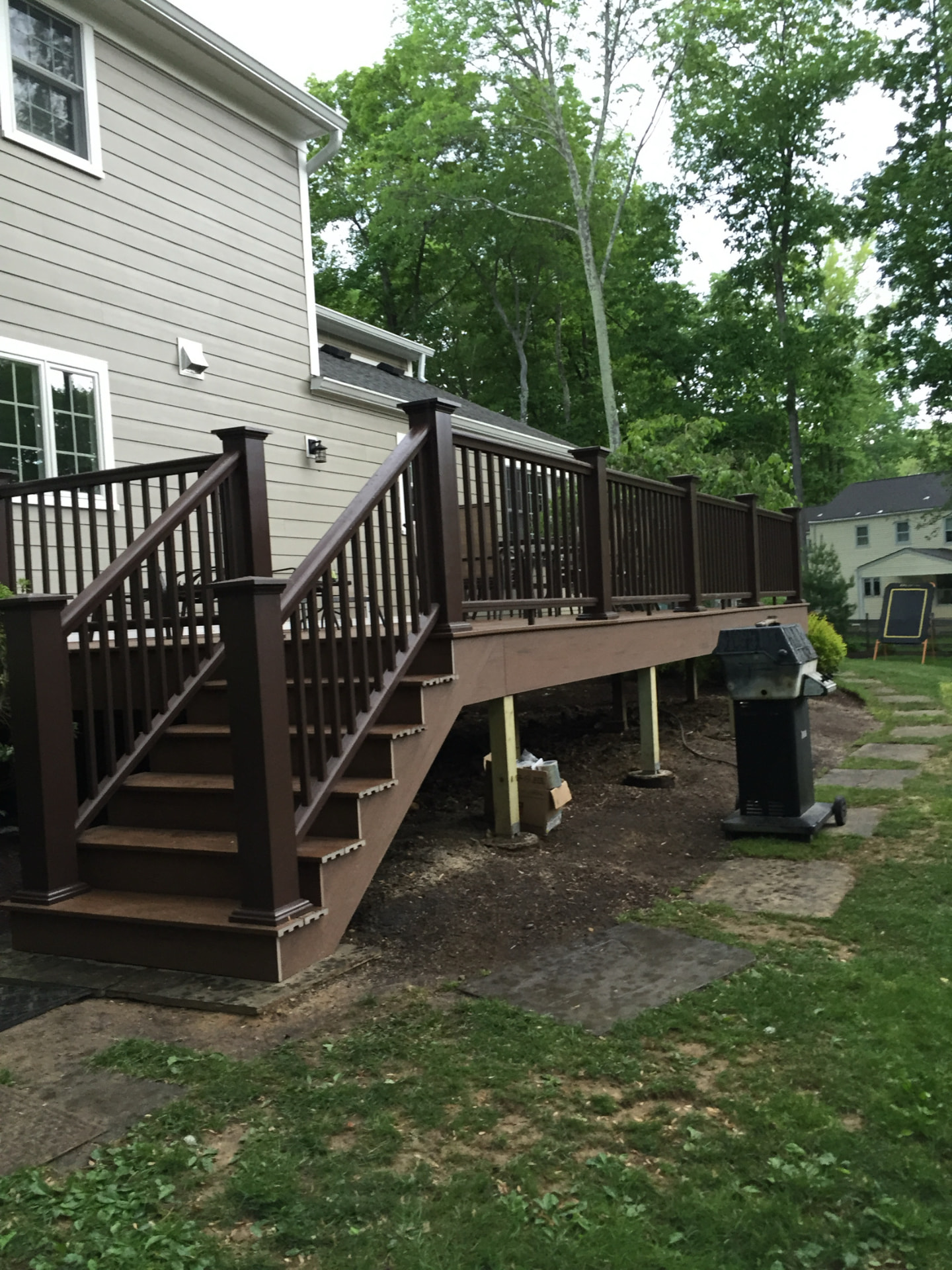 Elevated composite deck with staircase and railing