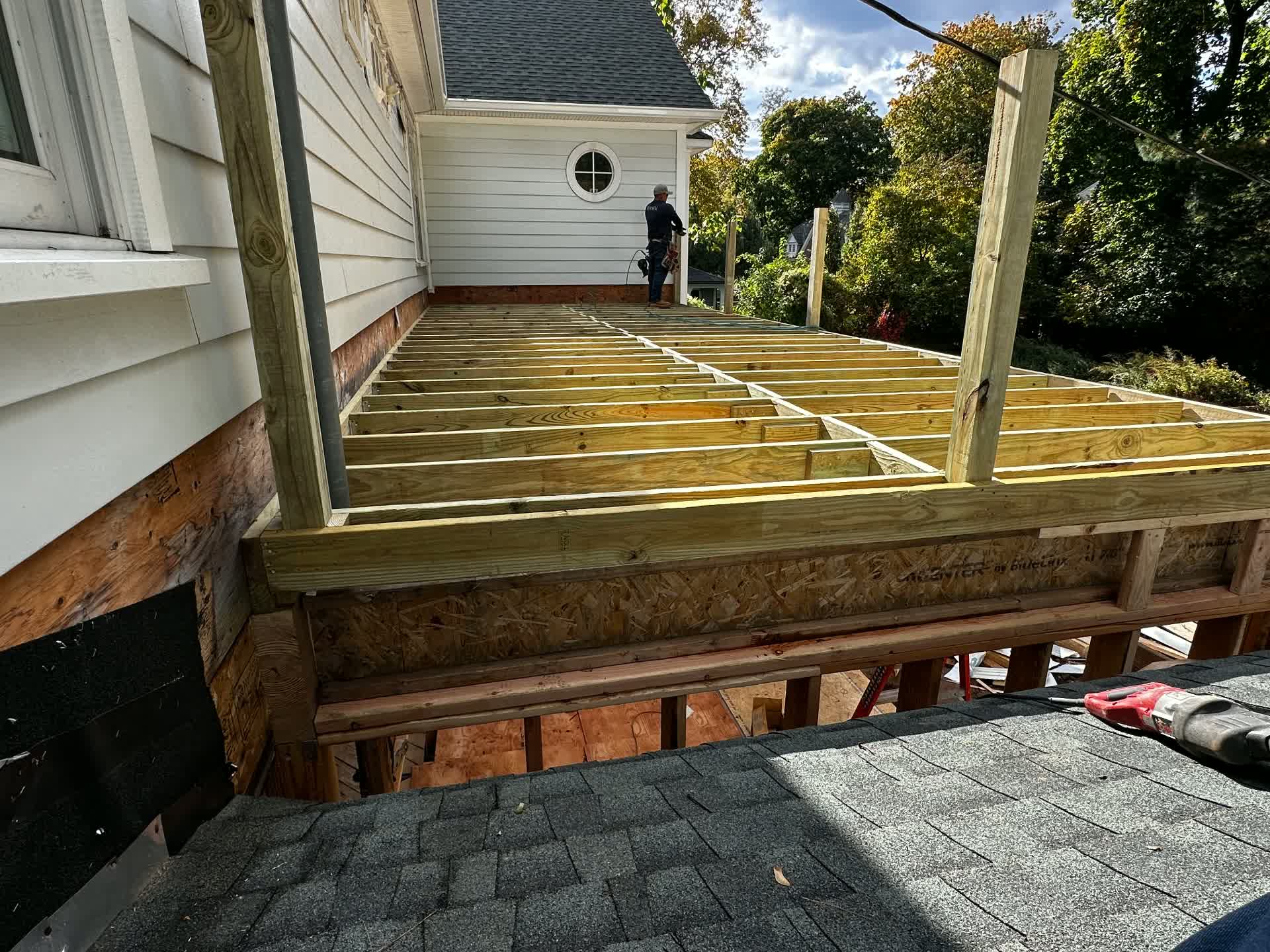 Deck joists and posts framed on the house